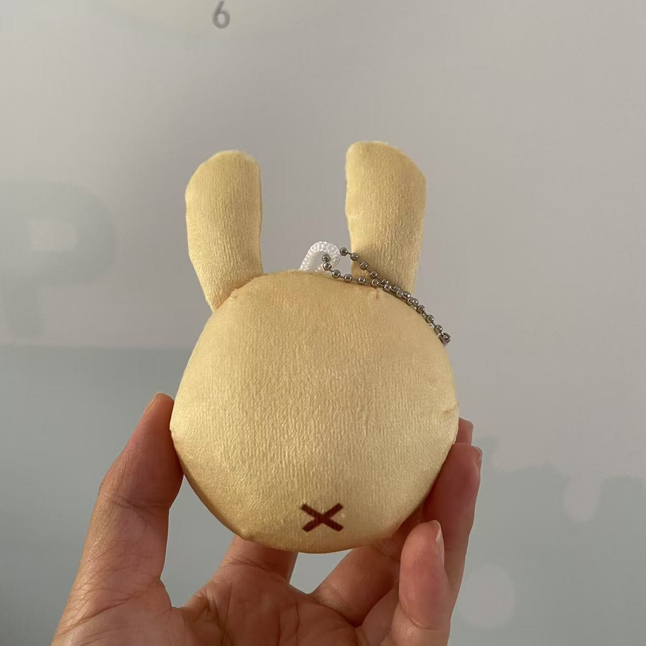 Neppienep – "The gear you get from the starting towns merchant in an RPG!" Straightface Plush Keychain